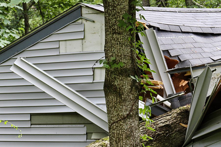 Storm damaged roof needing emergency roof repair in the Indianapolis area