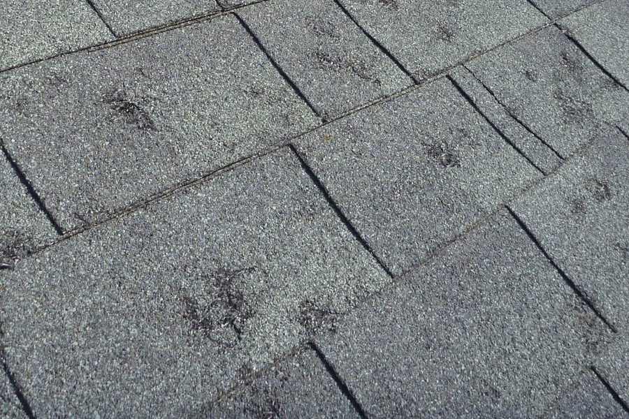 Emergency roof tarping over storm damage on an Indianapolis home