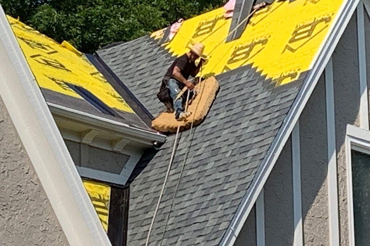 John Beal Roofing crew completing a roofing job for an Indianapolis area homeowner